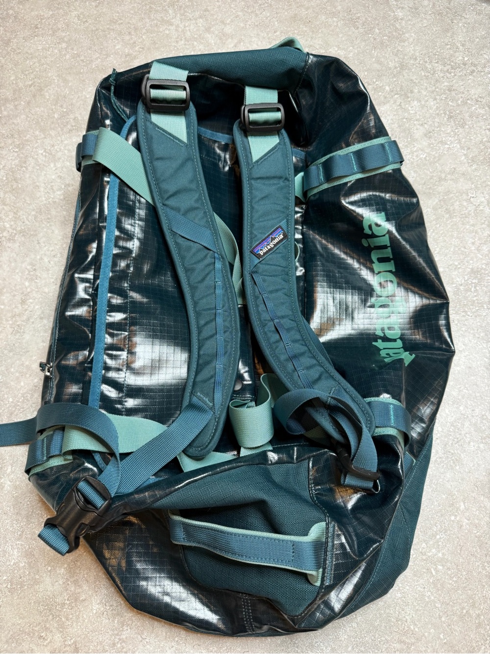 Patagonia Black Hole Duffle 60L in blue teal waterproof hiking camping backpack